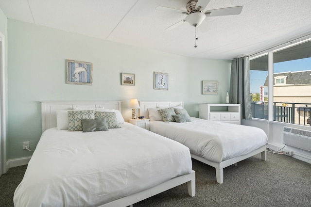 carpeted bedroom featuring access to exterior, ceiling fan, and baseboards