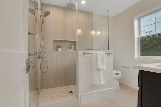 2045 W Ave, Ocean City, NJ 08226 - full bathroom with walk in shower, vanity, toilet, tile patterned floors, and baseboards