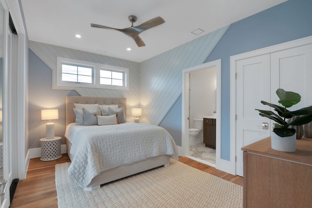 2045 W Ave, Ocean City, NJ 08226 - bedroom with an accent wall, baseboards, wood finished floors, recessed lighting, and ensuite bathroom