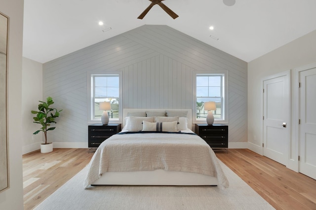 2045 W Ave, Ocean City, NJ 08226 - bedroom featuring baseboards, wood finished floors, vaulted ceiling, multiple windows, and wooden walls