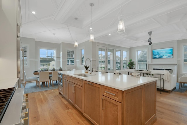 2045 W Ave, Ocean City, NJ 08226 - kitchen featuring a sink, coffered ceiling, light wood finished floors, light countertops, and plenty of natural light
