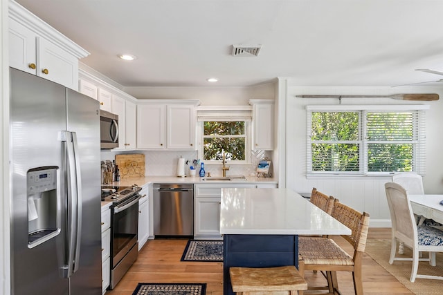 460 20th St Fl 2Nd, Avalon, NJ 08202 - kitchen featuring stainless steel appliances, light countertops, light wood-type flooring, and recessed lighting