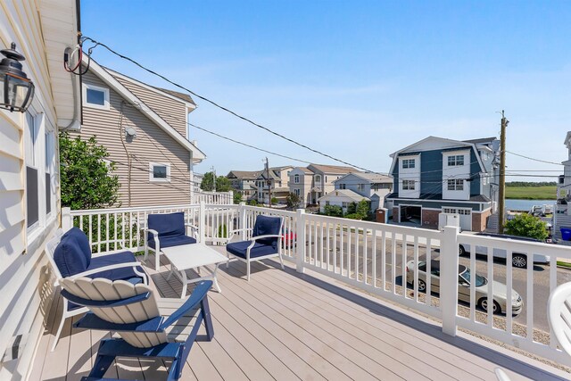 460 20th St Fl 2Nd, Avalon, NJ 08202 - wooden terrace featuring a residential view