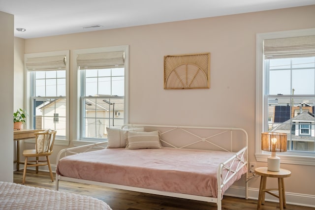 bedroom with hardwood / wood-style floors