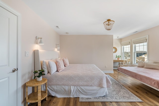 bedroom with hardwood / wood-style floors