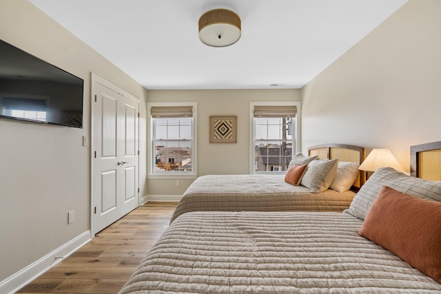 bedroom featuring light wood-type flooring