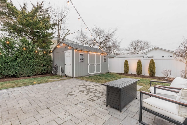 view of patio featuring a shed