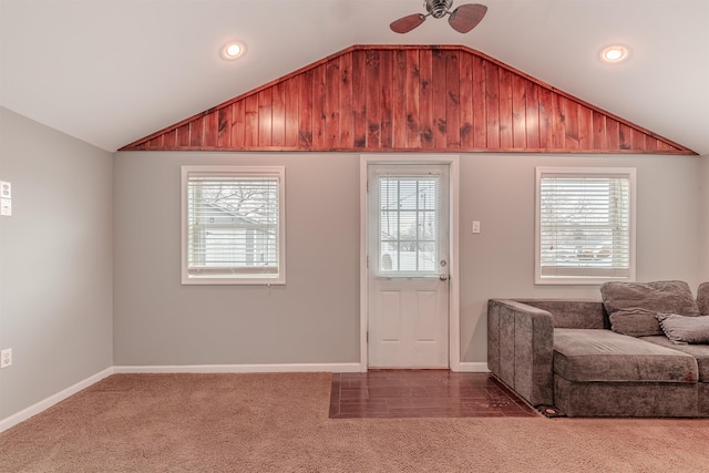 interior space with lofted ceiling and ceiling fan