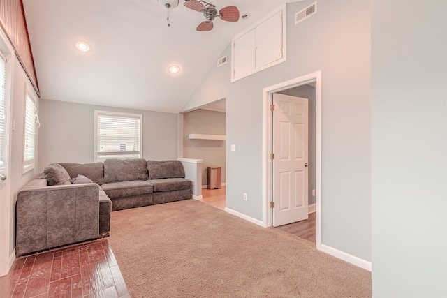 living room featuring ceiling fan, carpet floors, and high vaulted ceiling