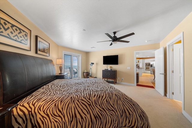 bedroom featuring ceiling fan, access to exterior, and light carpet