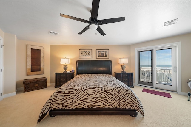 carpeted bedroom with access to exterior and ceiling fan