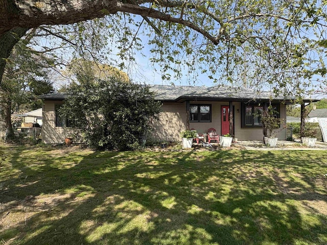 ranch-style home with a front lawn