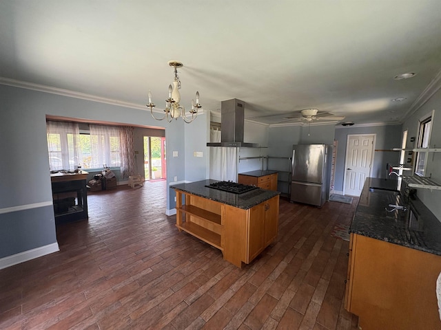 kitchen with black gas cooktop, range hood, open shelves, ornamental molding, and freestanding refrigerator