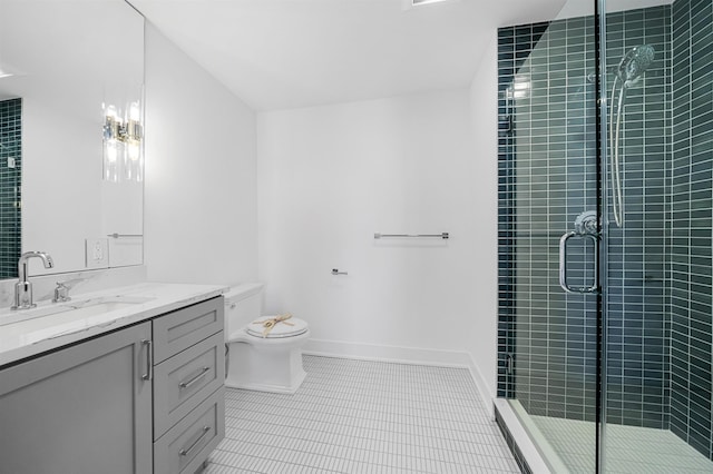 bathroom featuring toilet, vanity, tile patterned floors, and a shower with shower door