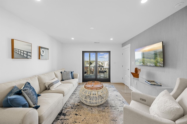 living room with light hardwood / wood-style flooring