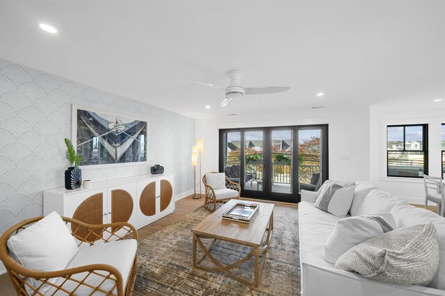 living room with hardwood / wood-style flooring and ceiling fan