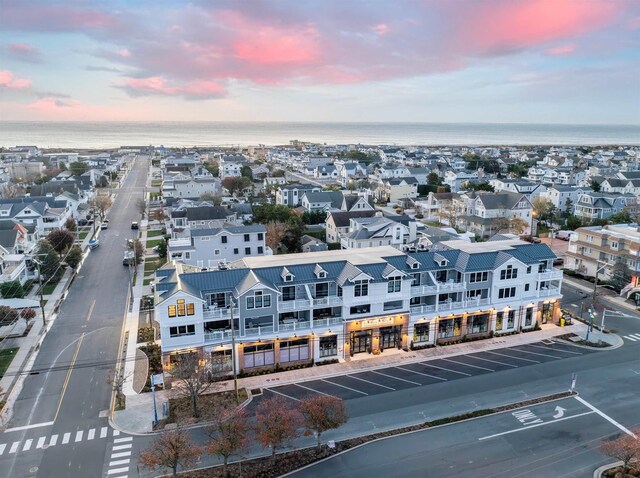 aerial view at dusk with a water view