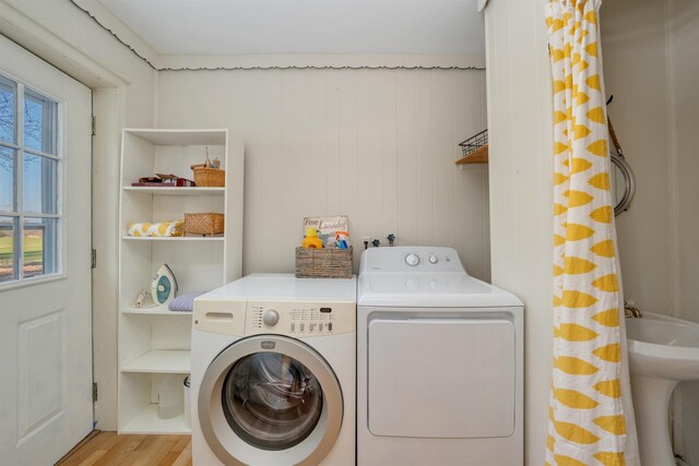 717 Third Ave, West Cape May, NJ 08204 - washroom featuring washing machine and clothes dryer and wood finished floors