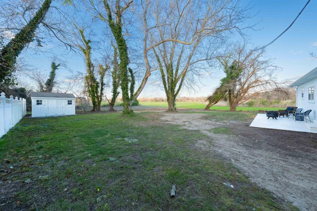 717 Third Ave, West Cape May, NJ 08204 - view of yard featuring a patio area, a storage shed, and a fire pit