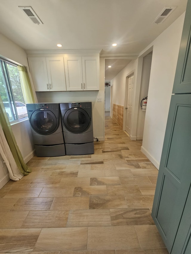 704 E Tampa Ave, Villas, NJ 08251 - laundry area featuring washing machine and dryer, cabinet space, light wood-type flooring, and recessed lighting