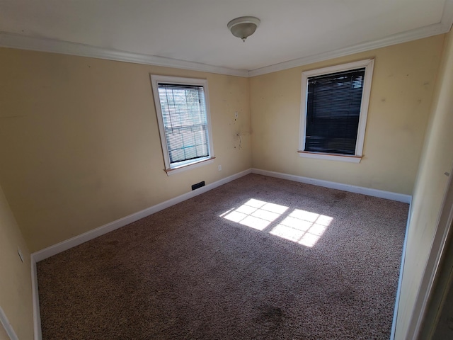 carpeted empty room with ornamental molding