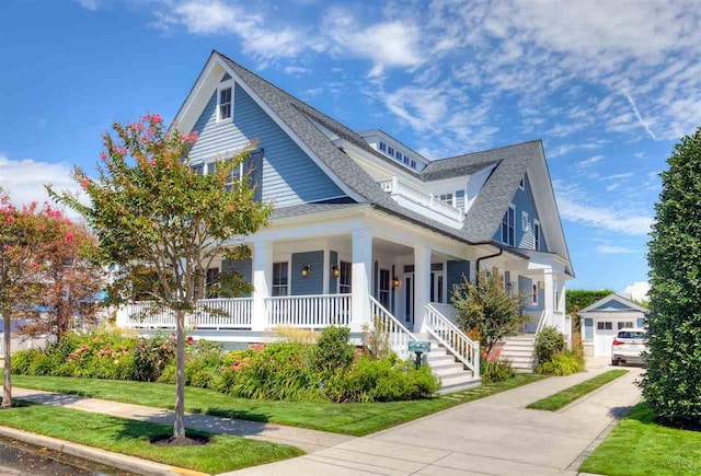 view of front of property featuring covered porch and a front yard