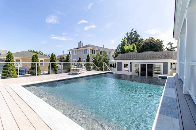 view of pool with an outbuilding