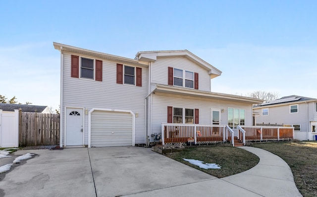 view of front property featuring a garage and covered porch