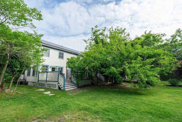 8281/2 Corgie St, Cape May, NJ 08204 - view of green lawn featuring a deck and stairway