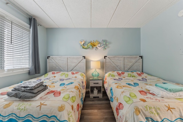 417 E 22nd Ave Unit 101, North Wildwood, NJ 08260 - bedroom with wood finished floors and a textured ceiling