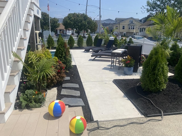 435 W Pine Ave, Wildwood, NJ 08260 - view of property's community featuring a residential view, fence, and a patio