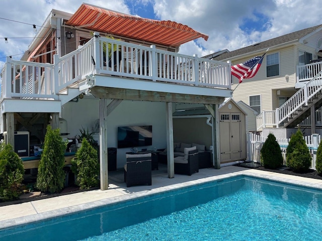 435 W Pine Ave, Wildwood, NJ 08260 - rear view of house featuring an outdoor living space, stairway, a storage shed, an outdoor pool, and an outdoor structure