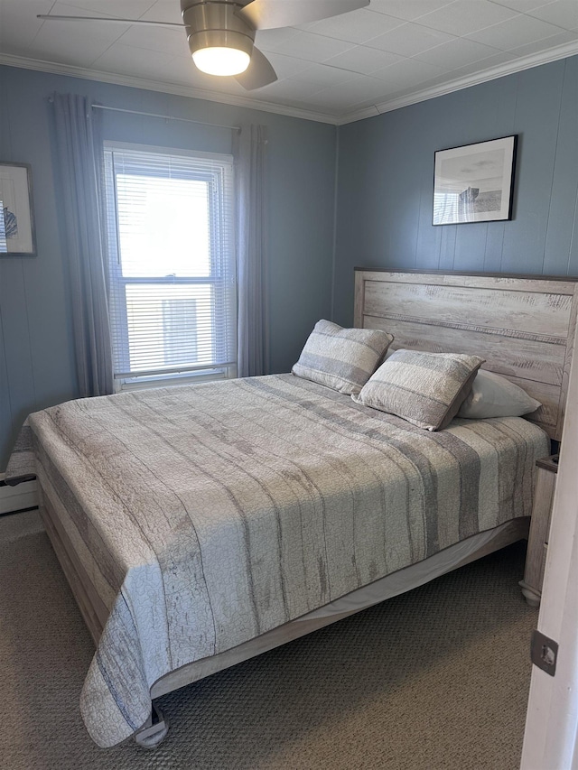 435 W Pine Ave, Wildwood, NJ 08260 - bedroom with crown molding, carpet, ceiling fan, a baseboard heating unit, and a decorative wall