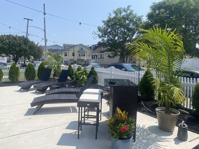 435 W Pine Ave, Wildwood, NJ 08260 - view of patio / terrace with fence, outdoor dining space, and a residential view