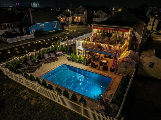 435 W Pine Ave, Wildwood, NJ 08260 - pool at twilight with a patio area and a fenced backyard