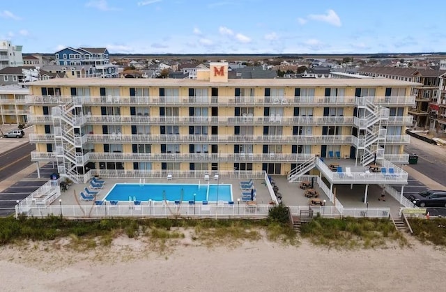 view of property featuring a community pool