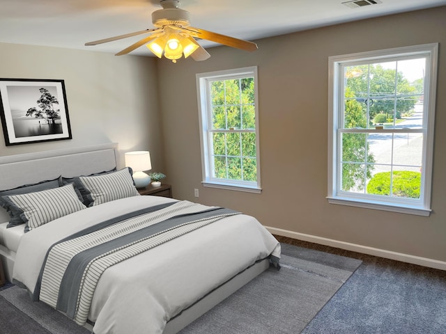 carpeted bedroom with ceiling fan