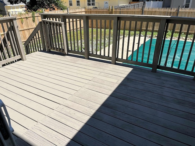 wooden terrace with a pool