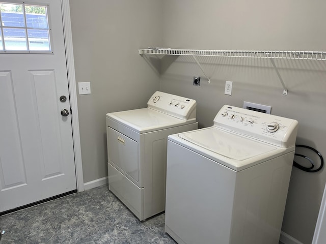 laundry area with washing machine and dryer