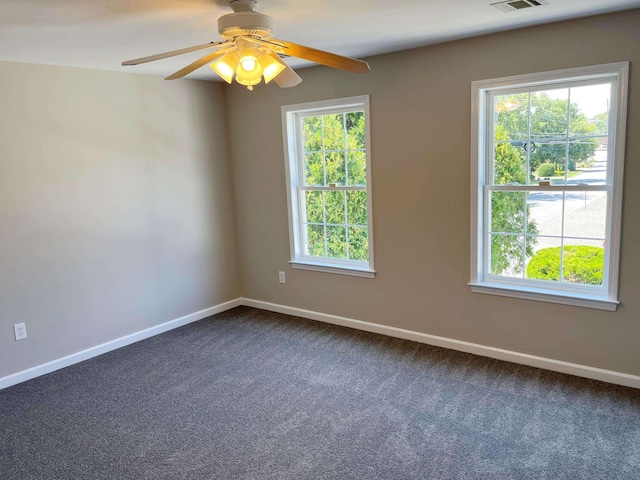 unfurnished room with carpet, plenty of natural light, and ceiling fan