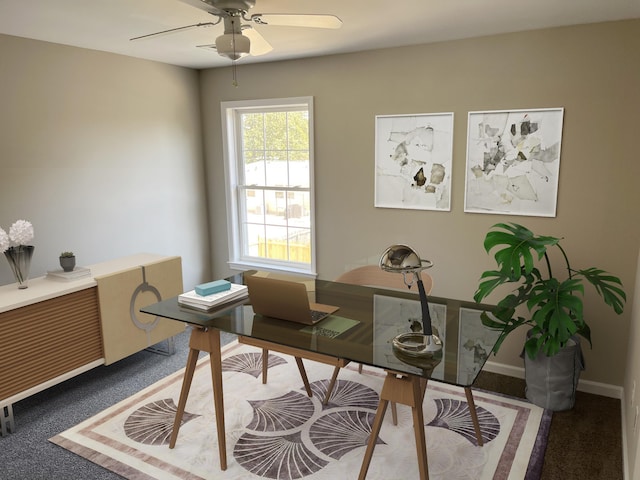 carpeted office featuring ceiling fan