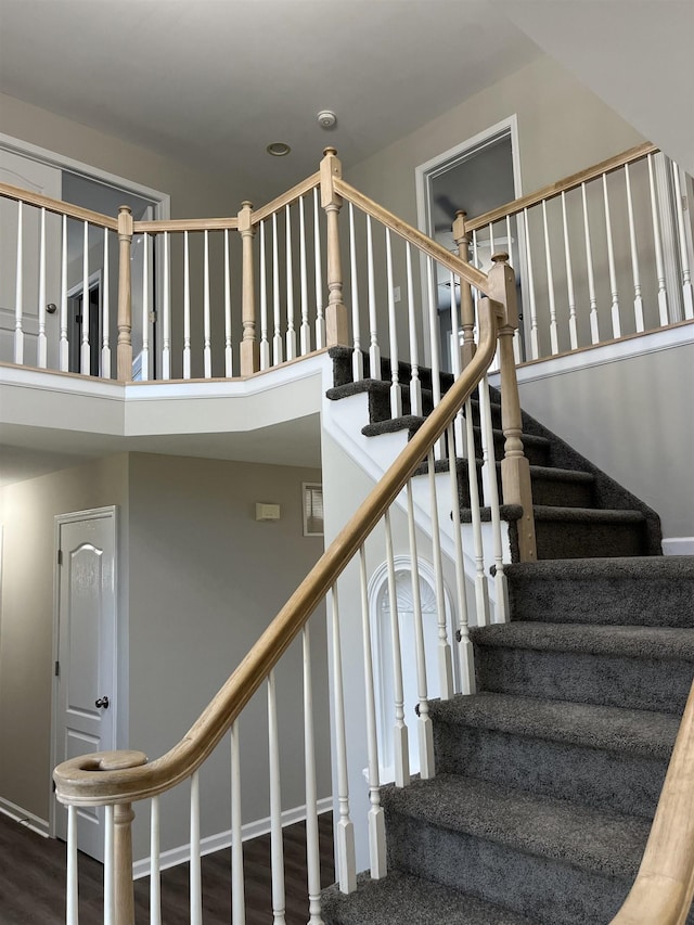 stairway with wood-type flooring