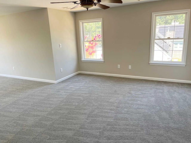 carpeted empty room with ceiling fan