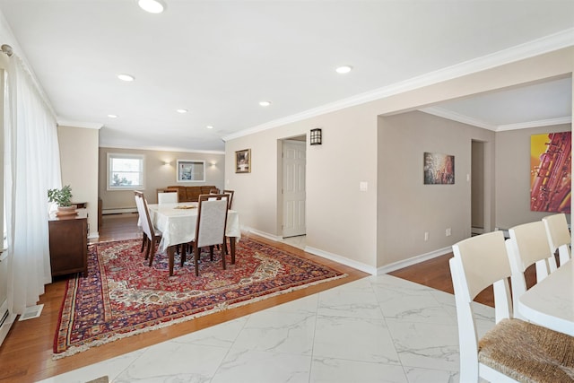 dining area featuring baseboard heating and ornamental molding