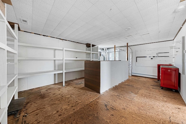 basement featuring a baseboard radiator