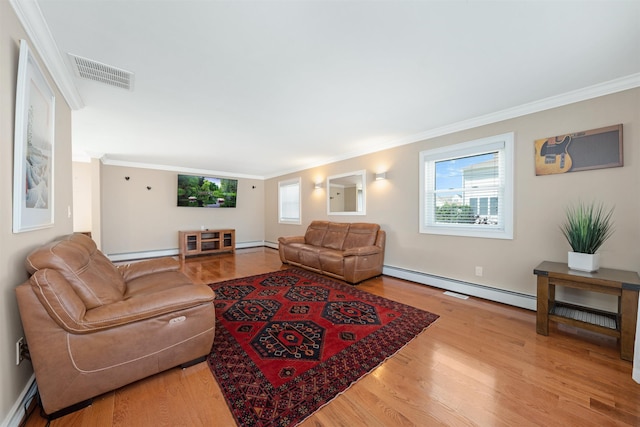 living room with a healthy amount of sunlight and baseboard heating