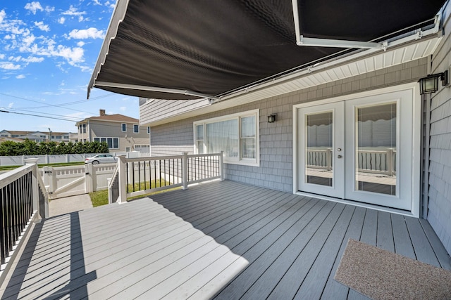 wooden deck featuring french doors