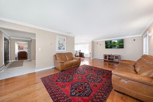 living room with light hardwood / wood-style flooring, baseboard heating, and ornamental molding
