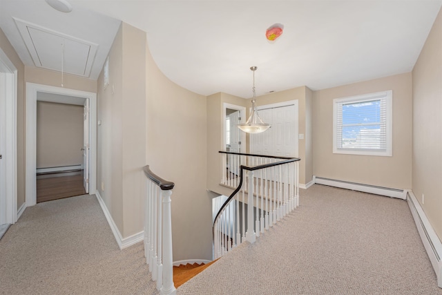 hall with light carpet and a baseboard radiator