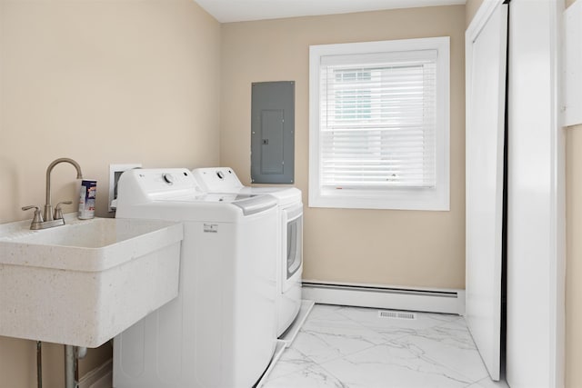 laundry area with baseboard heating, electric panel, sink, and washer and dryer